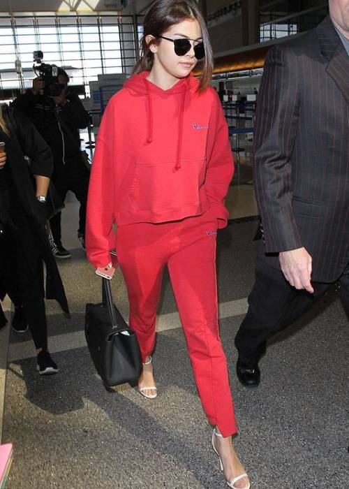 how to wear heels casually dress down your heels athletic wear outfit with heel selena red tracksuit
