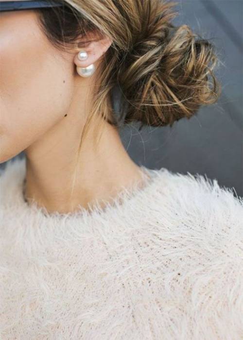 ways to wear pearls without looking old fashioned messy hair bun tied back modern pearl earring look