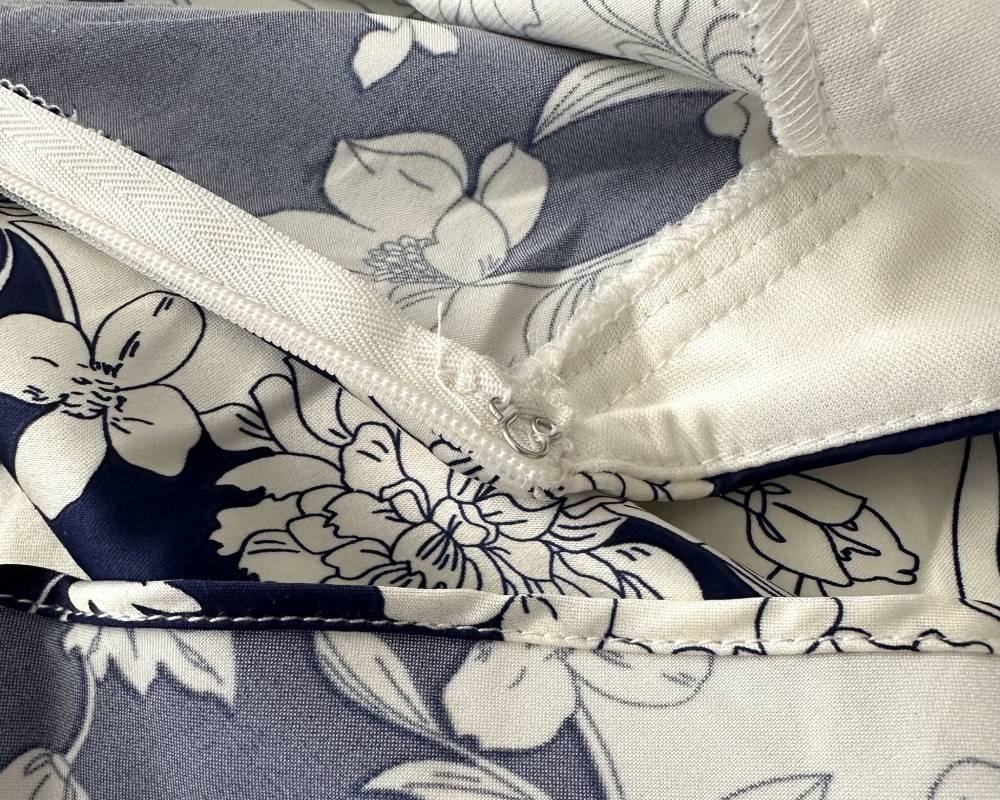 close up photo of tidy stitching and some loose threads on lulus tea gardens dress