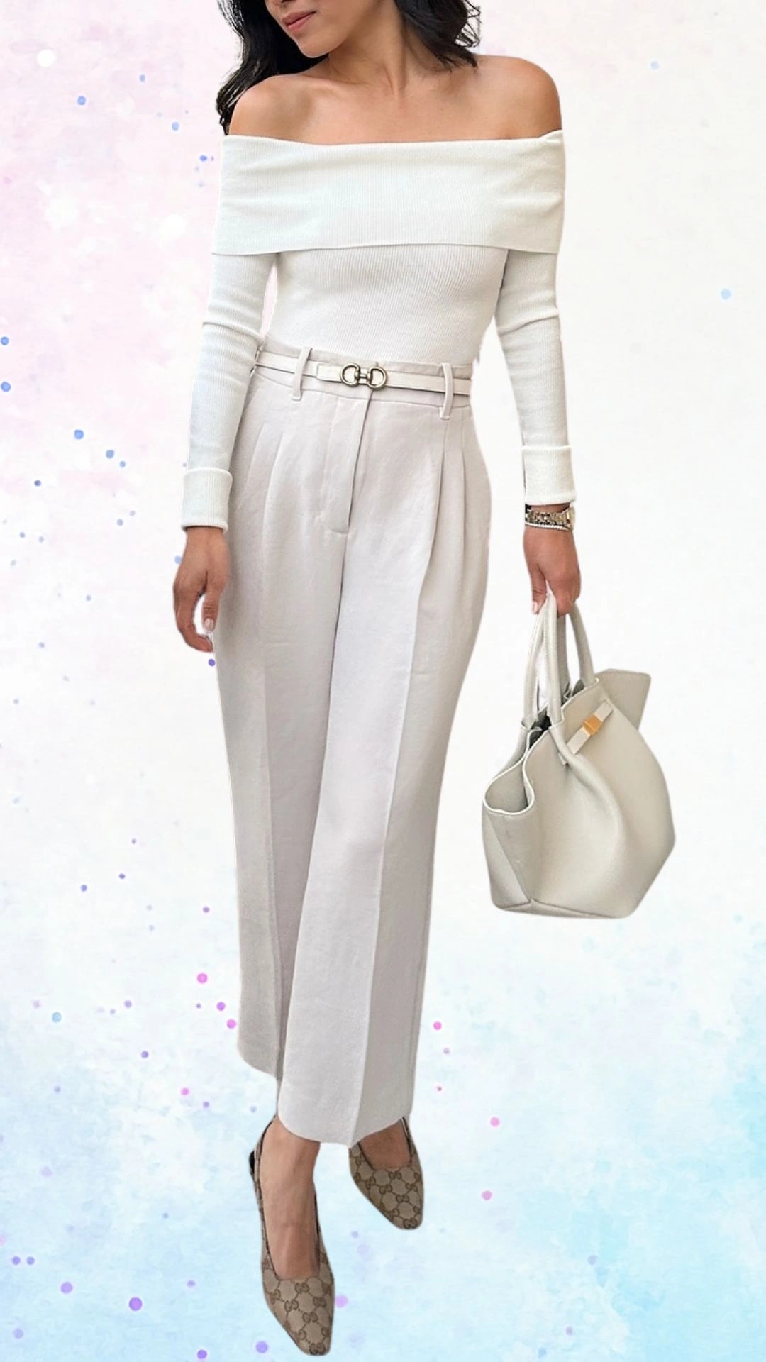 The outfit features a fitted, off-the-shoulder top made of ribbed white fabric, complemented by high-waisted, pleated light beige trousers. The ensemble is accessorized with a thin, chic belt and elegant pointed-toe heels, creating a sophisticated look suitable for a baby shower celebration. A stylish handbag completes the outfit, enhancing its overall elegance.