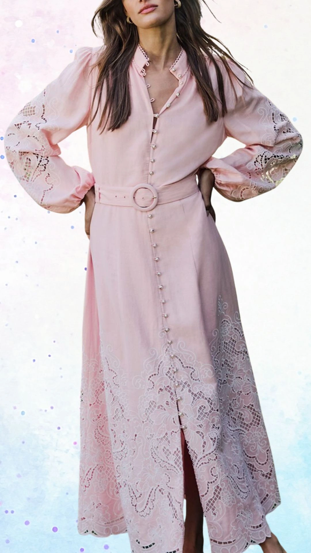 This elegant pink dress features long, puffed sleeves with lace detailing and a high neckline, accentuated by a series of pearl buttons running down the front. The waist is cinched with a matching belt, while the hem showcases intricate broderie accents, lending a whimsical touch perfect for a baby shower celebration. The lightweight fabric adds softness, making it a comfortable yet stylish choice for the occasion.