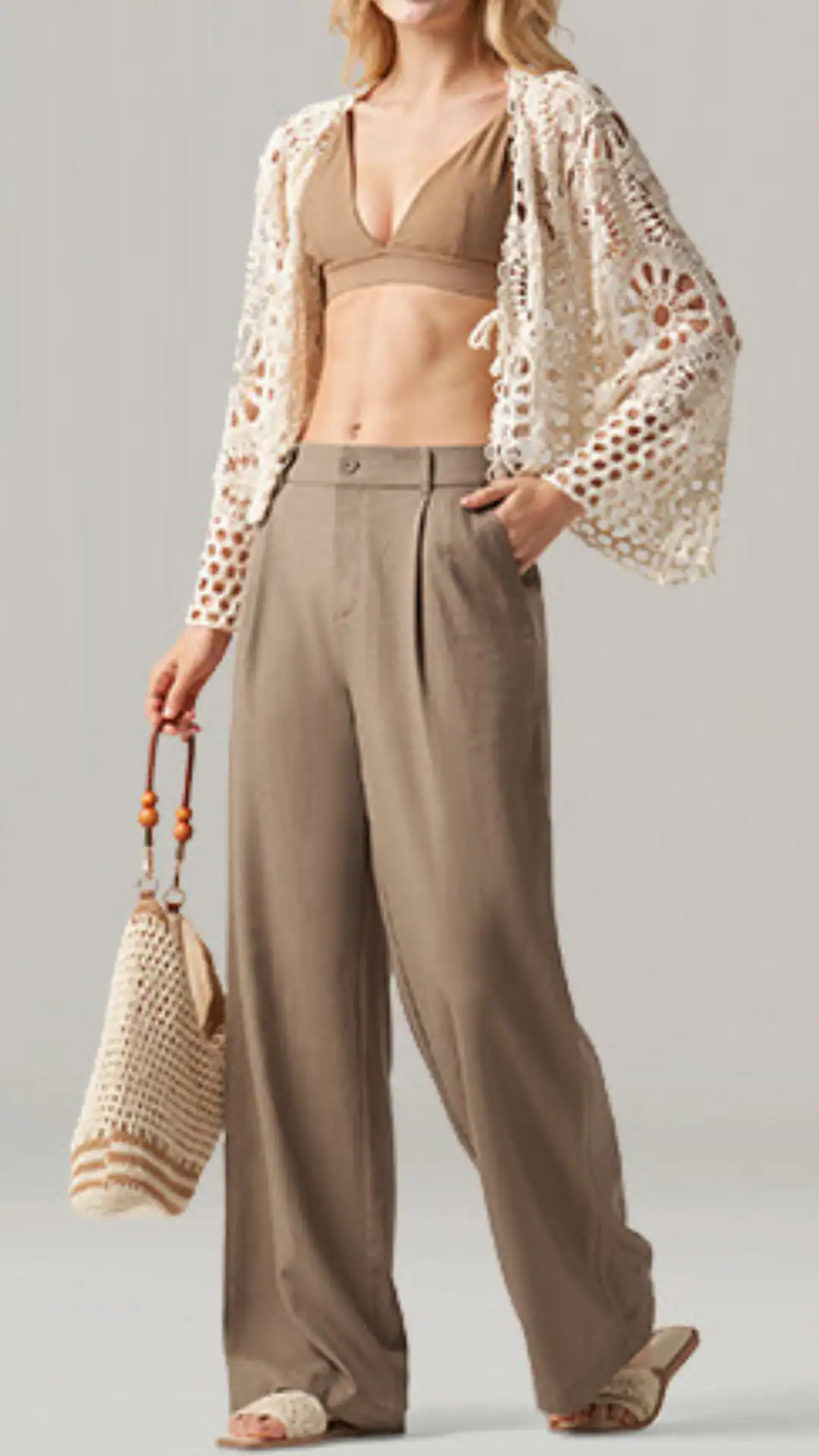 The outfit features relaxed beige linen wide-leg pants paired with a matching cropped bralette and an intricately designed open-knit crochet cardigan, creating a bohemian yet chic aesthetic. This ensemble is ideal for casual outings or beach events, combining lightweight, breathable fabrics for comfort in warm weather.