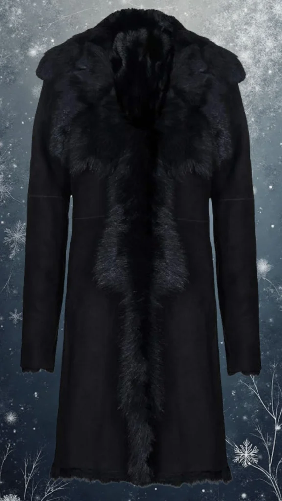 This elegant black coat features a luxurious faux fur collar and a sleek, soft woolen body, designed for warmth and style. The coat has a straight cut with long sleeves and a subtle front closure, creating a streamlined silhouette that exudes sophistication during winter. The combination of textures, including the smooth fabric and plush collar, adds depth and visual interest.