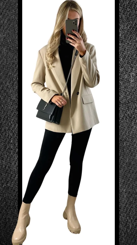 This outfit features form-fitting black jeans paired with a chic beige blazer that offers a stylish contrast. The look is complemented by sleek beige platform boots and a structured black handbag, adding modern sophistication while staying warm for cooler months. The combination of textures and colors creates a polished and elegant winter ensemble.