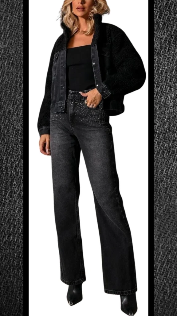 The outfit features a fitted black tank top paired with high-waisted black denim jeans that have a slightly relaxed fit and decorative stud detailing at the waistband. The look is completed with a plush black faux fur jacket that adds textural contrast, while sleek black ankle boots enhance the overall chic winter aesthetic. The ensemble combines comfort and style, ideal for cooler months.