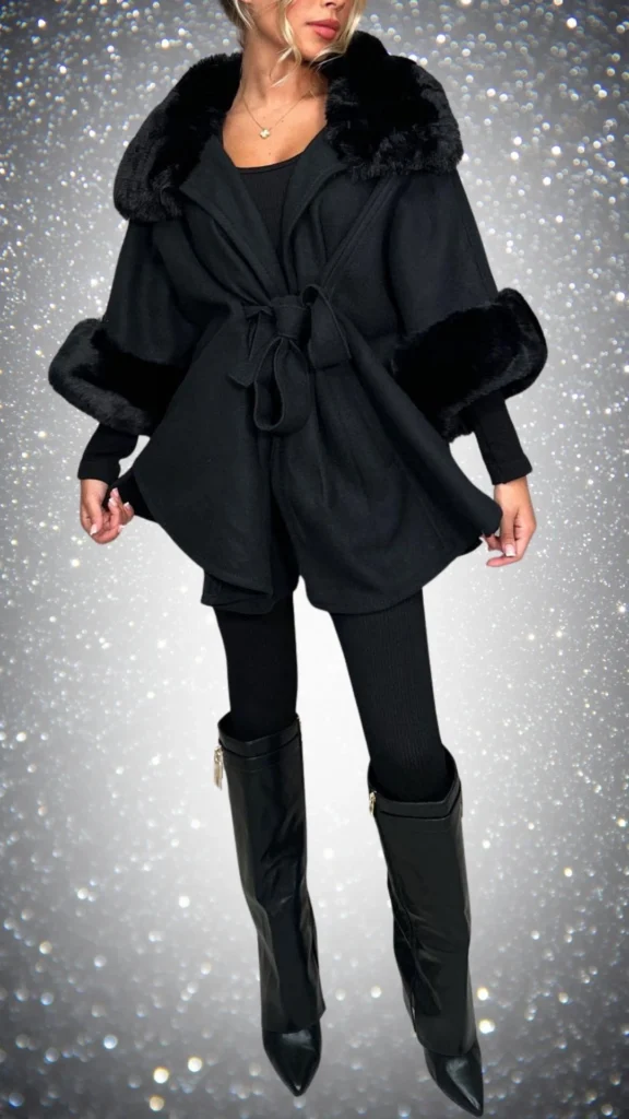 The outfit features a luxurious black wool-blend coat with a faux fur collar and cuffs, cinched at the waist with a matching tie. Underneath, a fitted black long-sleeve top is paired with textured black leggings, and complemented by sleek, knee-high black patent leather boots with a pointed toe. The ensemble is both stylish and warm, ideal for winter occasions.