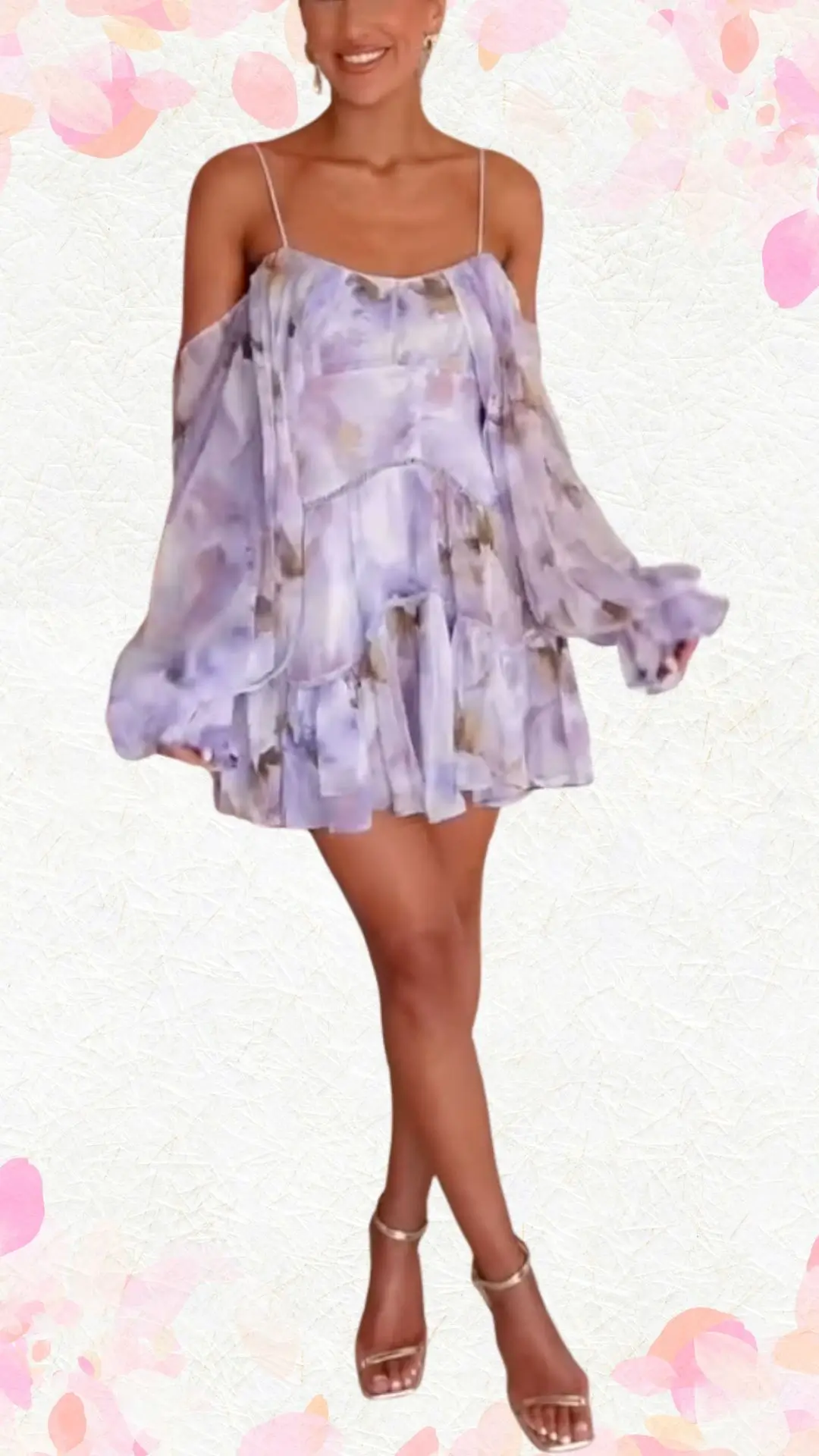 The outfit features a light lavender, off-the-shoulder mini dress made from a soft, flowing fabric with a delicate floral print. It has long, billowy sleeves, a relaxed fit, and playful tiered ruffles at the hem, creating a whimsical yet elegant look, perfectly suited for a bridal shower celebration. Paired with strappy metallic sandals, this ensemble strikes a balance between fun and refined.