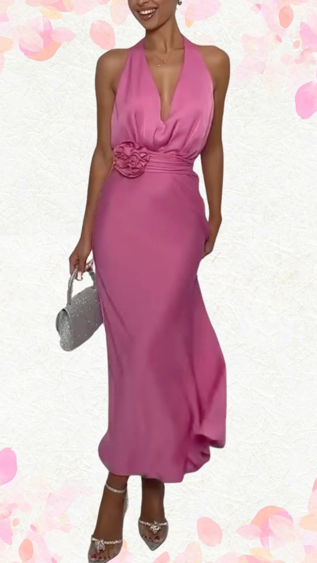 The outfit features a flowing, halter-style gown in a vibrant pink shade, constructed from a smooth, lightweight fabric that drapes elegantly to the floor. The dress showcases a plunging neckline and a waist accentuated by a decorative floral detail, blending sophistication with a playful touch. Paired with stylish silver open-toe heels, the overall look strikes a perfect balance between refined and whimsical, ideal for a bridal shower celebration.
