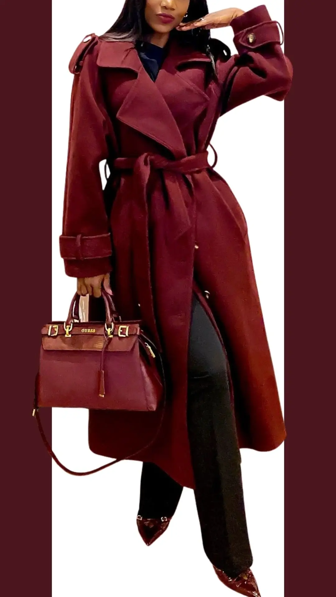 A stylish burgundy trench coat with a belted waist features wide, cuffed sleeves and a notched collar, paired with fitted black pants. The ensemble is complemented by matching burgundy pointed-toe heels and a structured handbag, creating a chic and coordinated look. The luxurious fabric offers a smooth texture, enhancing the outfit's elegance.