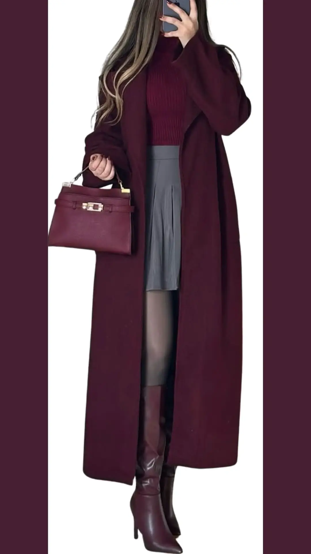 This outfit features a long, elegant burgundy coat made from a soft, structured fabric, layered over a fitted burgundy ribbed turtleneck. Below, a gray pleated skirt complements knee-high burgundy heeled boots, while a matching burgundy handbag adds a cohesive touch to the look. The ensemble showcases rich textures and harmonizing shades, creating a sophisticated and stylish appearance.