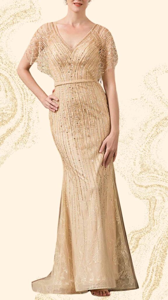 The champagne mother of the bride dress features a fitted silhouette with a dramatic floor-length design. It has a deep V-neckline and elegant cap sleeves adorned with intricate beadwork and sequins, enhancing its luxurious texture. The gown is accented with a belted waist that enhances the figure, and the soft fabric flows gracefully, making it perfect for a formal wedding setting.