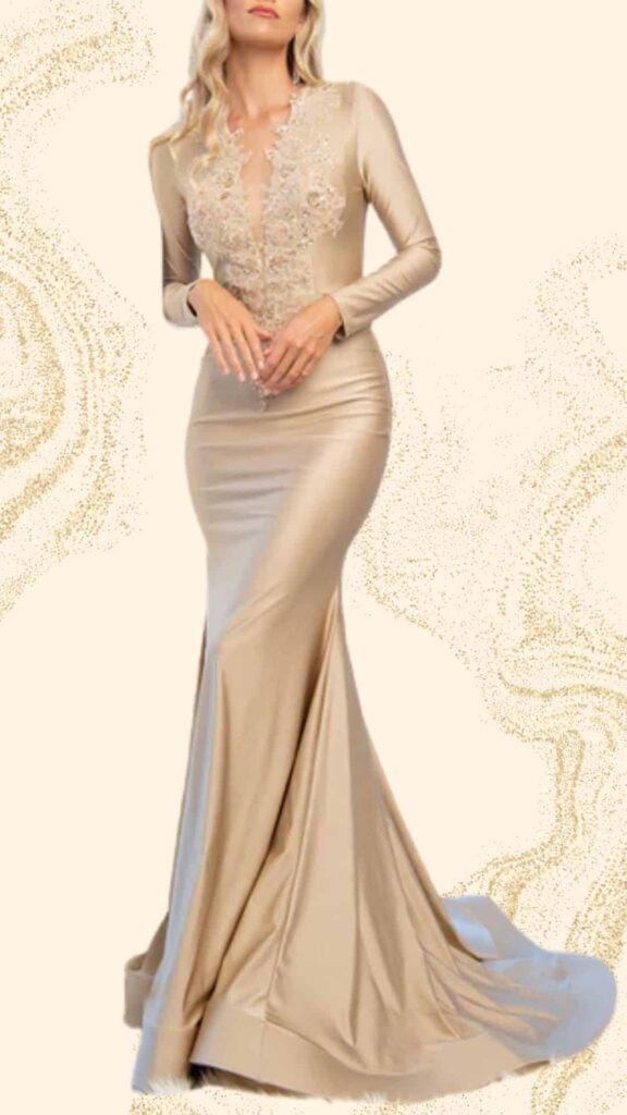 This champagne mother of the bride dress features a fitted mermaid silhouette, accentuating the figure with a floor-length design. It has a deep V-neckline adorned with delicate floral embellishments, and long sleeves that create an elegant contrast to the smooth, luxurious fabric. The gown's sleek texture flows gracefully into a dramatic train, perfect for a formal wedding setting.