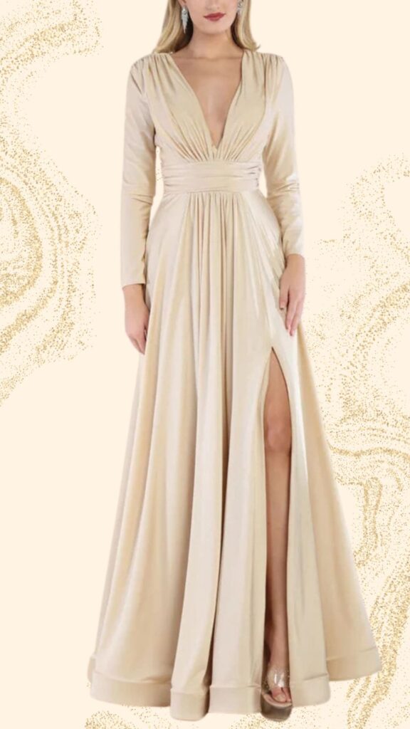This champagne mother of the bride dress features a floor-length design with a plunging V-neckline and long sleeves, creating an elegant silhouette. The gown is made of a smooth, flowing fabric that drapes beautifully and includes a thigh-high slit for a touch of sophistication. The waist is cinched with a matching belt, enhancing the figure and adding to its classic appeal.