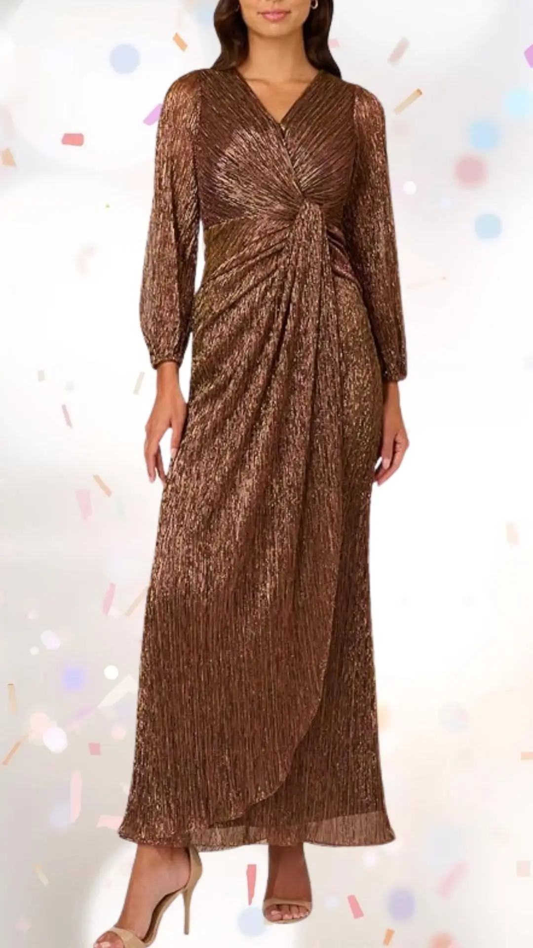 The dress features a rich bronze hue with a shimmering, pleated texture that adds elegance without being overly formal. Designed with long sleeves and a deep V-neckline, it has a stylish knot detail at the waist, creating a flattering silhouette, while the floor-length skirt flows gracefully. Its refined yet playful style is complemented by the subtle shine, making it a perfect choice for an engagement party.
