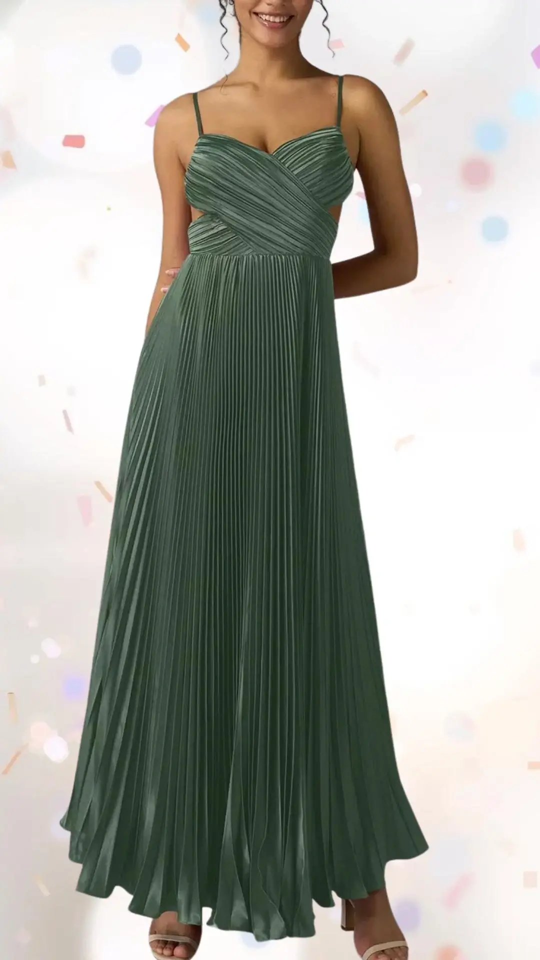 This elegant engagement party dress features a flowing, pleated design in a rich, muted green shade, crafted from a smooth, lightweight fabric. The dress has delicate, thin straps and a flattering sweetheart neckline, creating a graceful silhouette that balances class with a touch of whimsy, perfect for celebratory occasions. Its floor-length style and subtle movement add a sense of fun while maintaining an elevated look.
