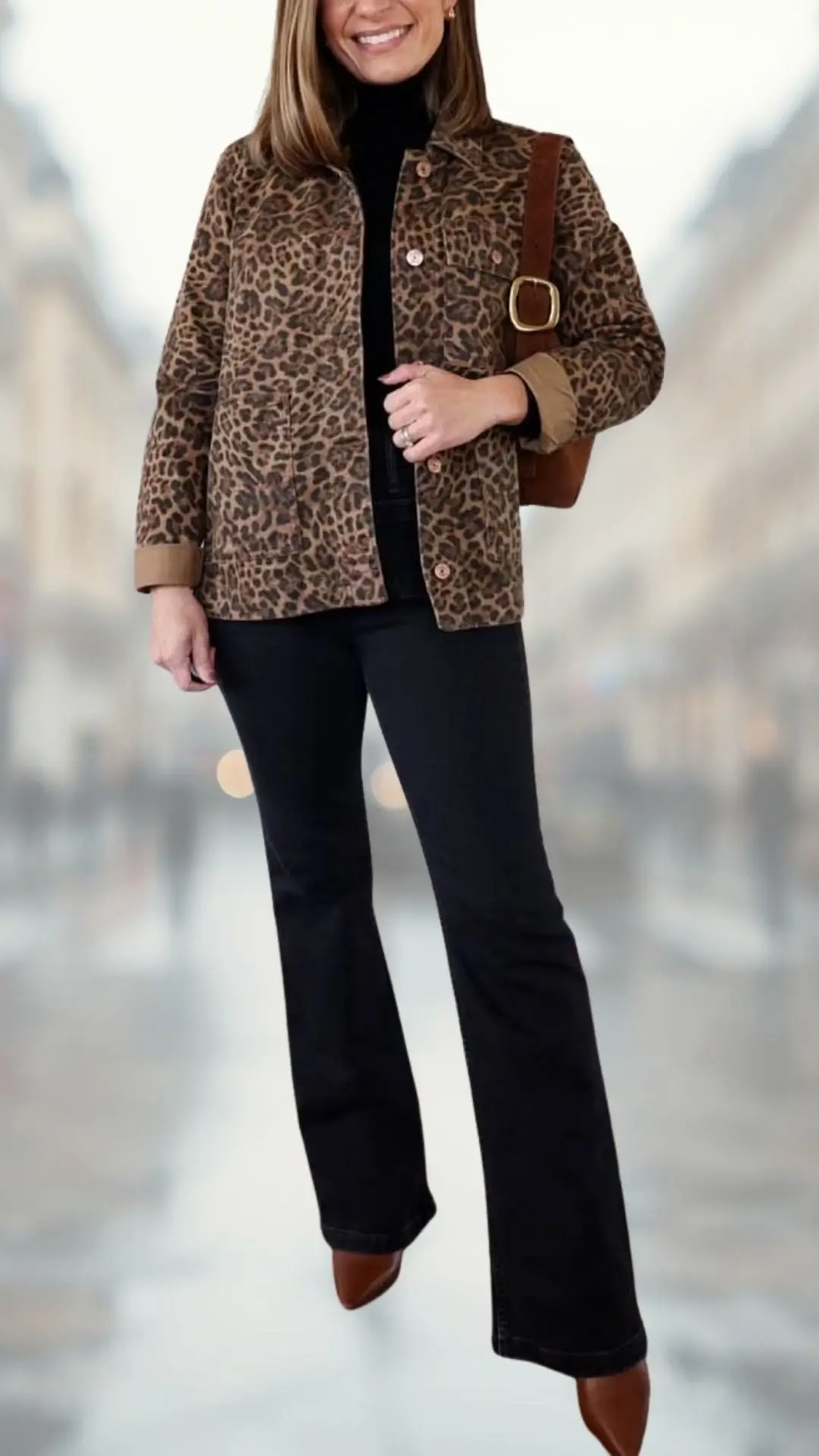The outfit features a leopard-print denim jacket with a soft texture, layered over a fitted black turtleneck. Complemented by flared black jeans and brown heeled ankle boots, this ensemble offers a stylish combination of patterns and solid colors, creating a chic and modern look. A brown shoulder bag adds functional elegance to the overall appearance.