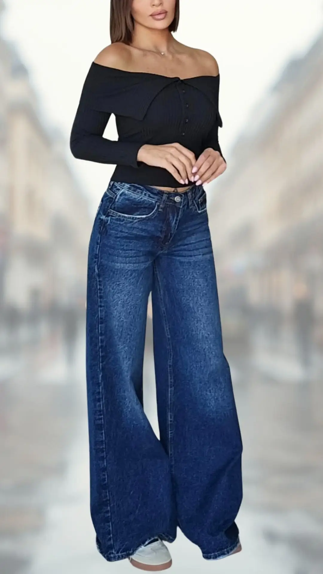 The outfit features a fitted black ribbed off-the-shoulder top with a button detail, complemented by high-waisted flare jeans in a deep blue denim fabric that create a striking silhouette. The jeans have a relaxed fit and a wide leg that adds movement, paired with casual white sneakers for a laid-back yet stylish look. This ensemble showcases a modern blend of elegance and comfort.