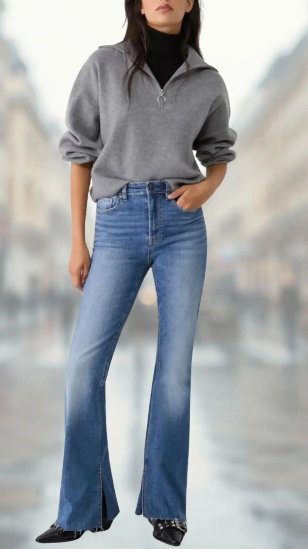 The outfit features a cozy, light gray zip-up sweater with a relaxed fit and rolled sleeves, layered over a fitted black turtleneck. The high-waisted flare jeans are crafted from medium-wash denim with a soft texture, flowing elegantly at the hem. Black pointed-toe ankle boots complete the look, adding a sleek touch to this stylish ensemble.