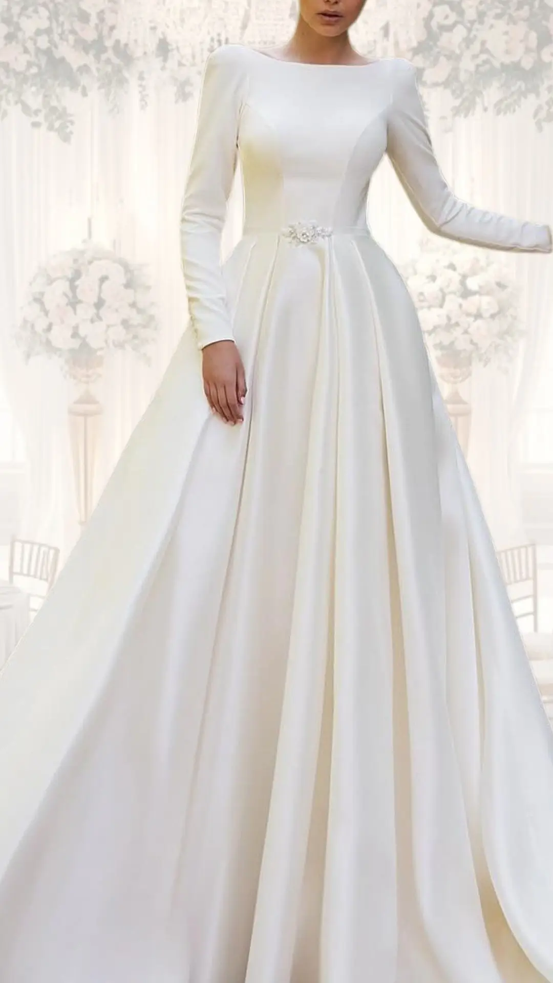 This high neck wedding gown features a classic A-line silhouette crafted from luxurious satin, exuding elegance with its smooth texture and soft sheen. Long, fitted sleeves complement the modest neckline, while a delicate beaded sash at the waist enhances the timeless design, making it ideal for winter weddings or vintage themes. The flowing skirt cascades gracefully, creating an ethereal look perfect for a sophisticated bridal ensemble.