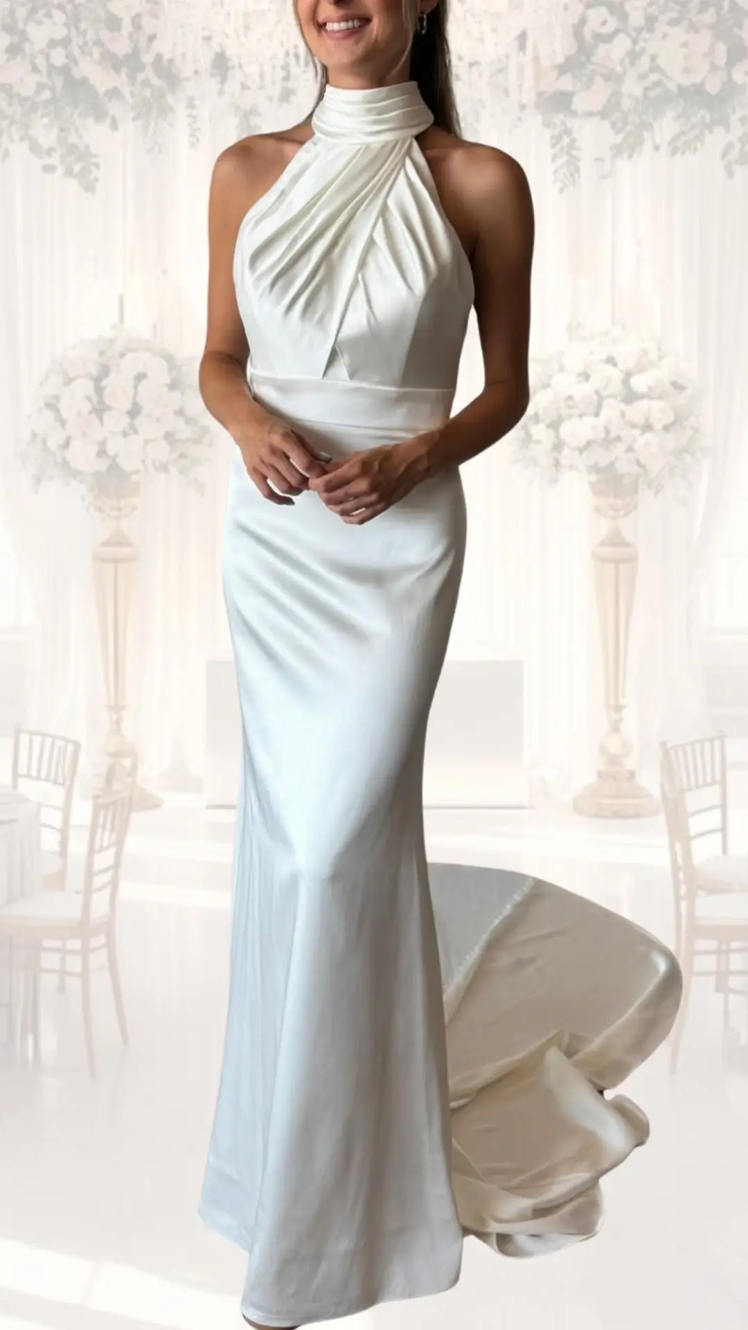This high neck wedding gown features a fitted sleeveless silhouette crafted from smooth satin, exuding elegance for a winter or vintage-inspired celebration. The intricately pleated bodice leads into a sleek, contouring skirt that gracefully flows into a subtle train, all in a soft ivory shade that enhances the overall classy and modest aesthetic.