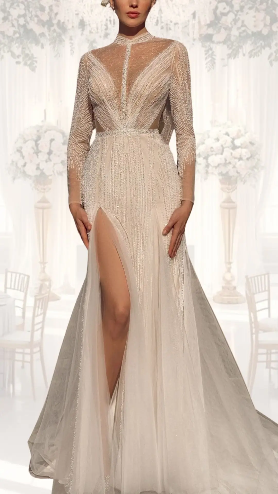 This high neck wedding gown features long, sheer sleeves and intricate beadwork, creating a classy, vintage look suitable for a winter wedding. The fitted bodice transitions into a flowing skirt with a high slit, crafted from a delicate, textured fabric in a soft ivory shade that enhances its elegance. The gown's subtle shimmer and structured design highlight a modest yet sophisticated aesthetic.