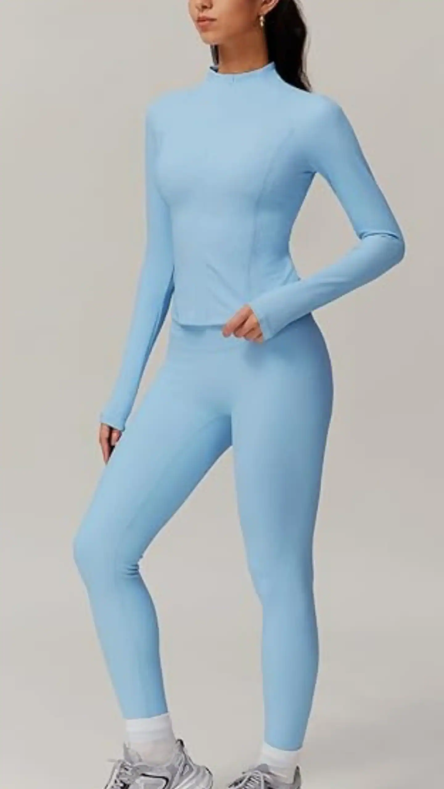 These high-waisted leggings, crafted from a breathable, stretchy blue fabric, feature a seamless design with a ribbed waistband for enhanced tummy control and a gusseted crotch for comfort during workouts. Ideal for activewear, this stylish yet functional piece exudes a fresh and vibrant vibe perfect for gym sessions or casual outings.