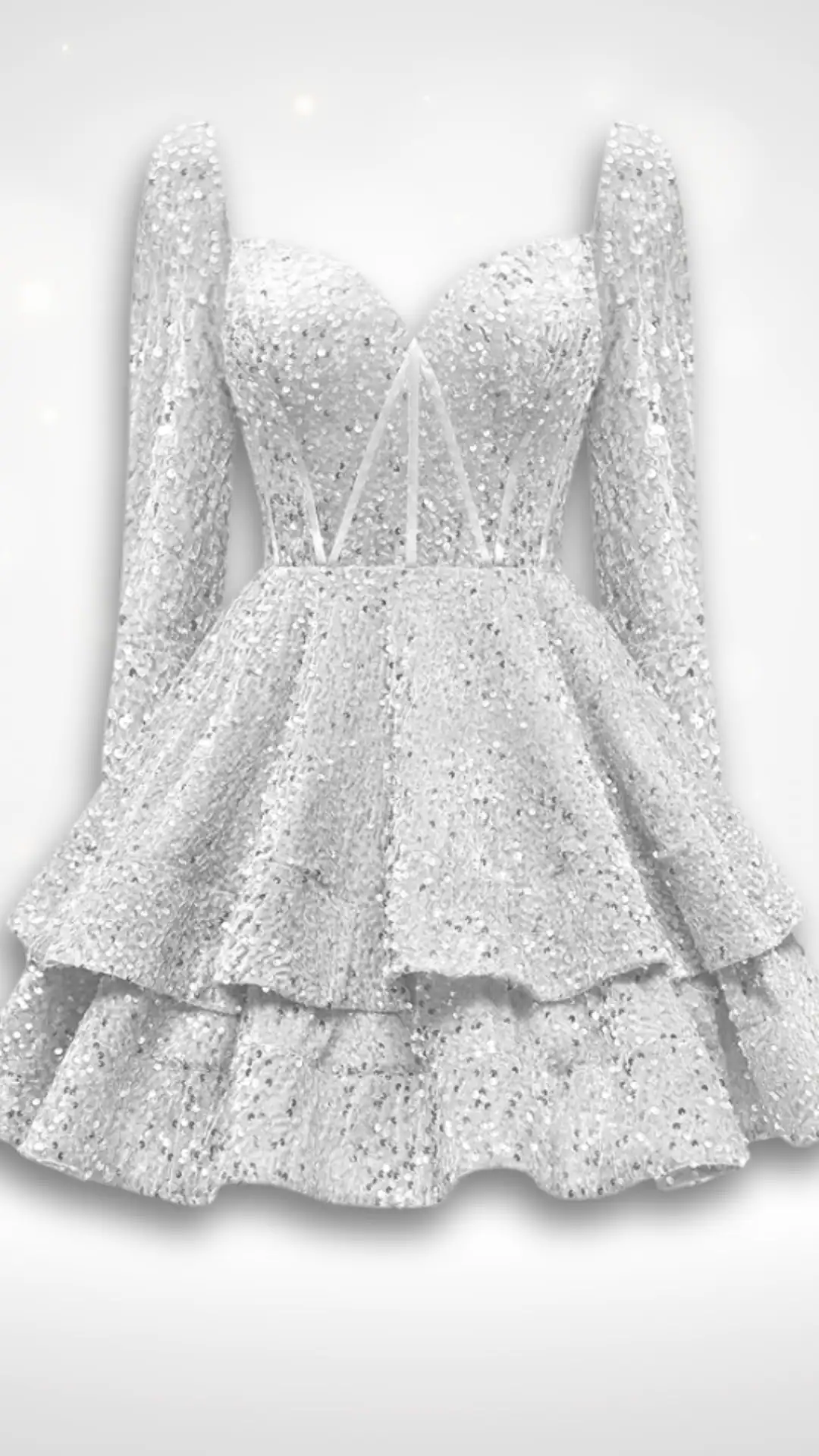 This stunning homecoming dress features a shimmering sequined fabric in a radiant white hue, offering a glamorous and festive vibe. The fitted bodice is complemented by long sleeves and a playful tiered skirt, creating an enchanting silhouette perfect for teen girls attending a formal event or school dance.