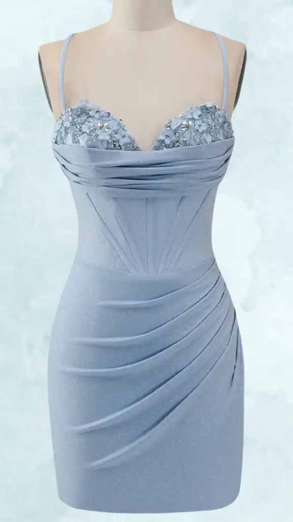 This tight homecoming dress features a sleek, fitted silhouette crafted from a shimmery light blue fabric. The bodice is adorned with delicate floral appliqués and shimmering embellishments, complemented by structured pleats that enhance the form-fitting design. With thin spaghetti straps and a subtly corseted fit, this dress accentuates the body while offering a sophisticated yet playful look.