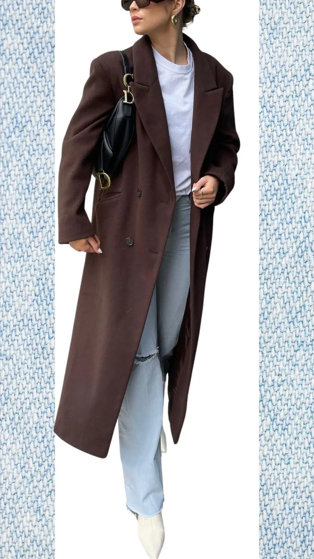 The outfit features light blue high-waisted jeans made from soft denim, complemented by a white cotton t-shirt layered beneath a chic, oversized brown wool coat that adds warmth. Accessories include round gold hoop earrings and a sleek black handbag, while pointed white ankle boots complete the look, making it stylish and suitable for transitioning from winter to spring.