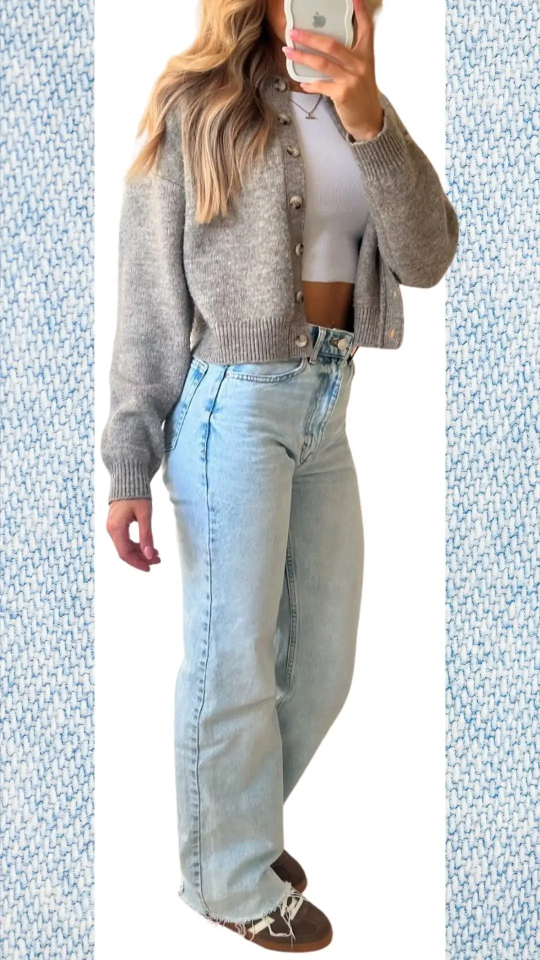 The outfit features light blue high-waisted jeans made from soft denim with a relaxed fit, complemented by a cozy, cropped grey cardigan crafted from warm knit fabric. Paired with a fitted white top, the ensemble is accessorized with a subtle necklace and brown sneakers, making it both stylish and suitable for colder months transitioning into spring. The overall look combines comfort with a modern aesthetic.