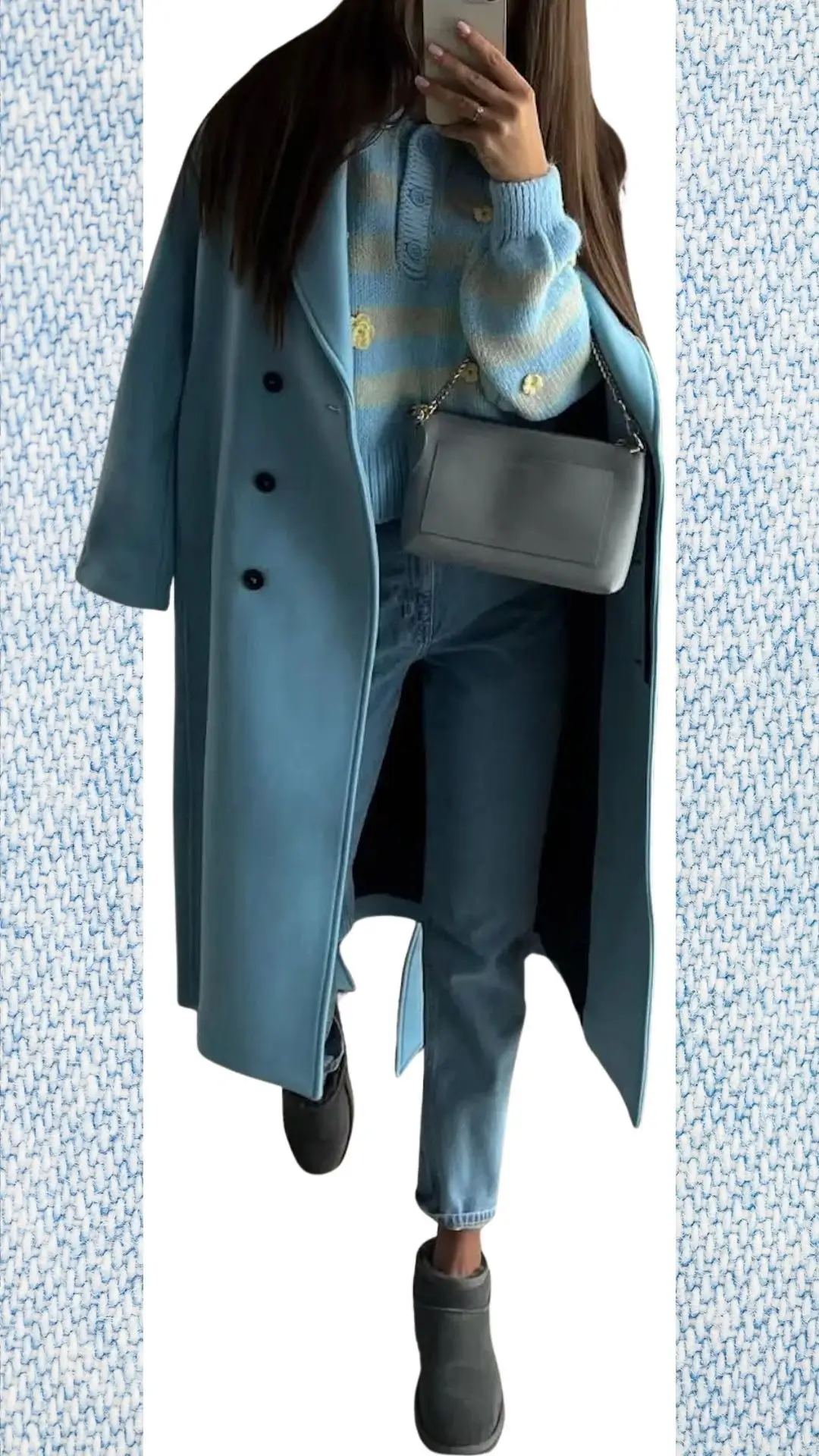 The outfit features a light blue oversized coat made from a soft, smooth fabric, layered over a cozy, pastel blue striped knit sweater with a ribbed texture and button detailing. The high-waisted, light blue jeans are fitted at the ankle, complemented by grey suede ankle boots, and a sleek, grey crossbody bag adds a chic touch, making it ideal for colder months transitioning to spring.
