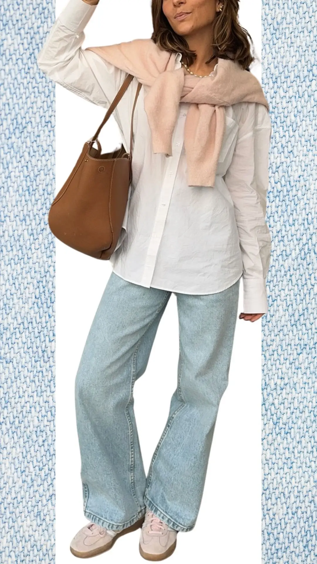 The outfit features relaxed-fit light blue jeans made from soft denim, paired with a crisp white button-up shirt that has a slightly crinkled texture. A light pink knitted sweater is stylishly draped around the shoulders, and the look is completed with pale pink sneakers and a brown leather handbag, creating a warm and chic ensemble perfect for colder months and transitioning into spring.