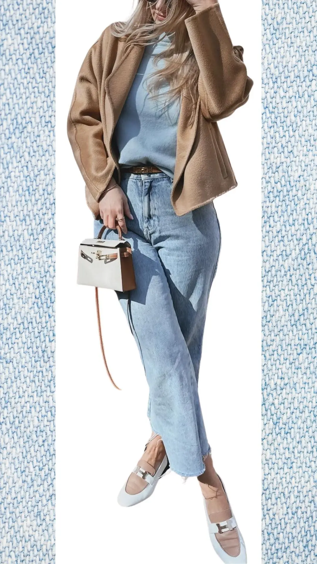 The outfit features light blue high-waisted jeans paired with a soft, pastel blue sweater and a cozy, tan oversized jacket, crafted from warm, textured fabric. Complemented by stylish, ankle-length flat shoes in light tones, the look incorporates a small, structured handbag with contrasting accents. This ensemble is perfect for transitioning between colder months and spring, offering warmth while maintaining a fresh, fashionable appearance.