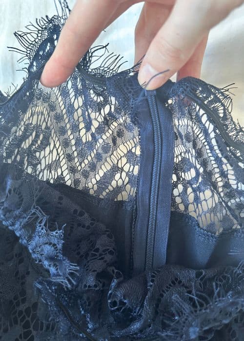 Closeup of zipper and lace detail on formal navy jumpsuit from lightinthebox