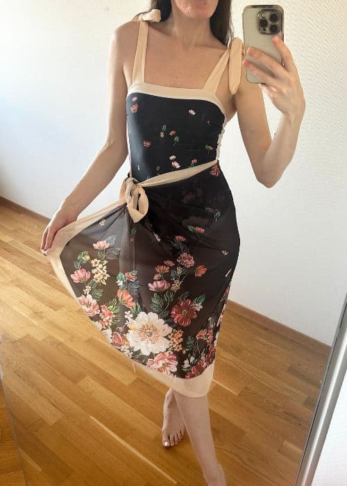 woman wearing black and cream floral bathing suit with matching serong from lightinthebox