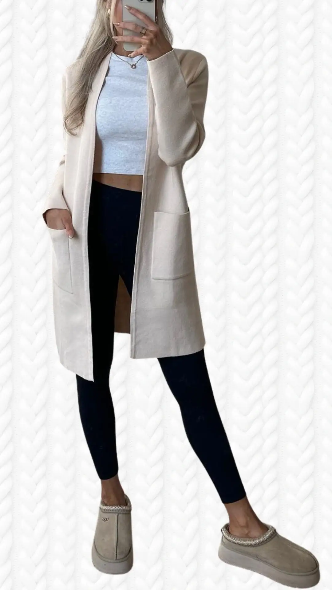 The outfit features a long, cream-colored cardigan made of soft, textured fabric, with a relaxed fit and open front, complemented by two front pockets. It is paired with a light gray crop top and form-fitting black leggings, providing a stylish contrast. Completing the look are cozy beige slip-on shoes with a decorative collar, perfect for a comfortable yet chic ensemble.