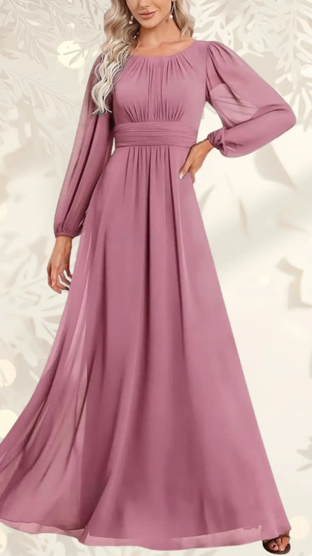 The dress features a soft mauve color with long, flowing sleeves and a fitted bodice that gathers elegantly at the waist. Its floor-length design creates a graceful silhouette, perfect for a wedding guest. The fabric has a light, airy quality that adds movement and sophistication.