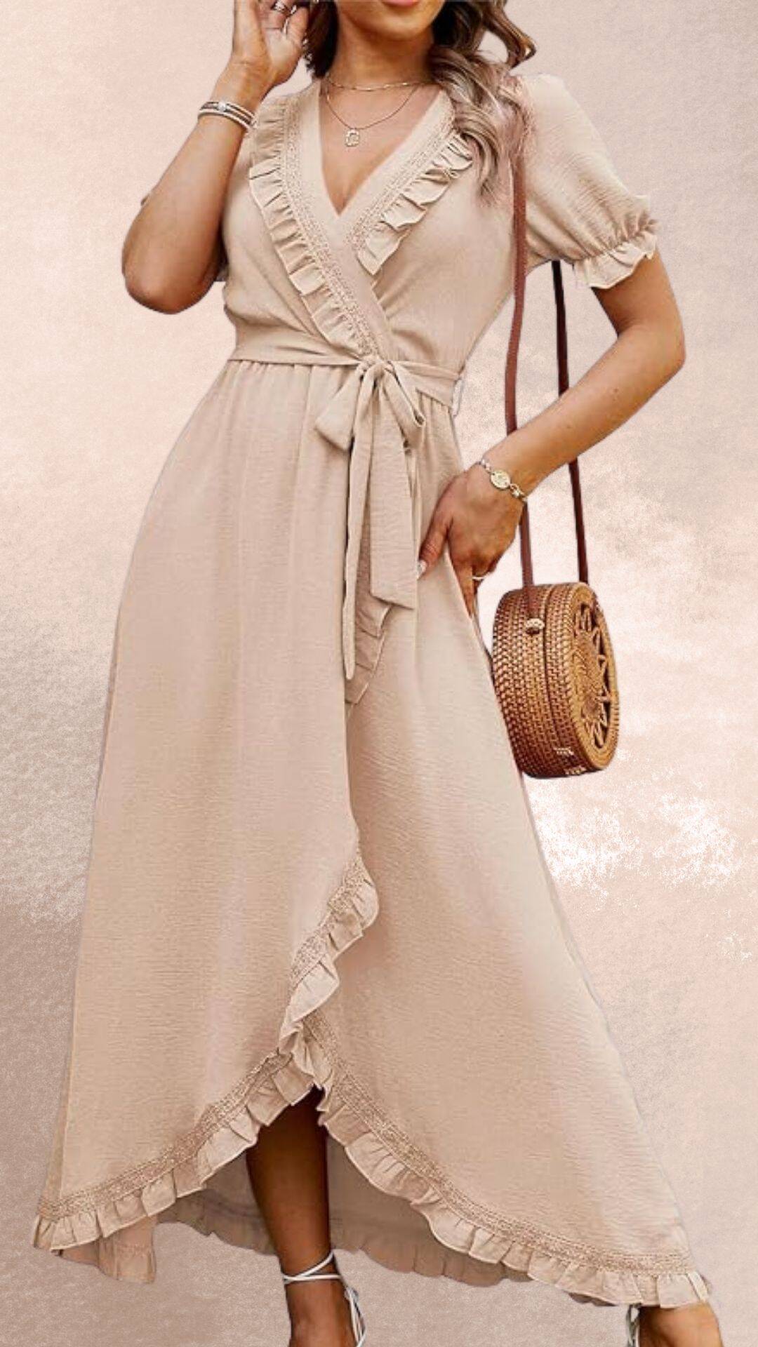 The dress features a soft beige fabric with a wrap-style design, accentuated by delicate ruffles along the neckline and hem. Its flattering silhouette features a tied waist that enhances a feminine shape, making it an elegant choice that pairs beautifully with cowboy boots for a country western vibe. Short sleeves and a flowing maxi length complete the look, combining comfort and style.