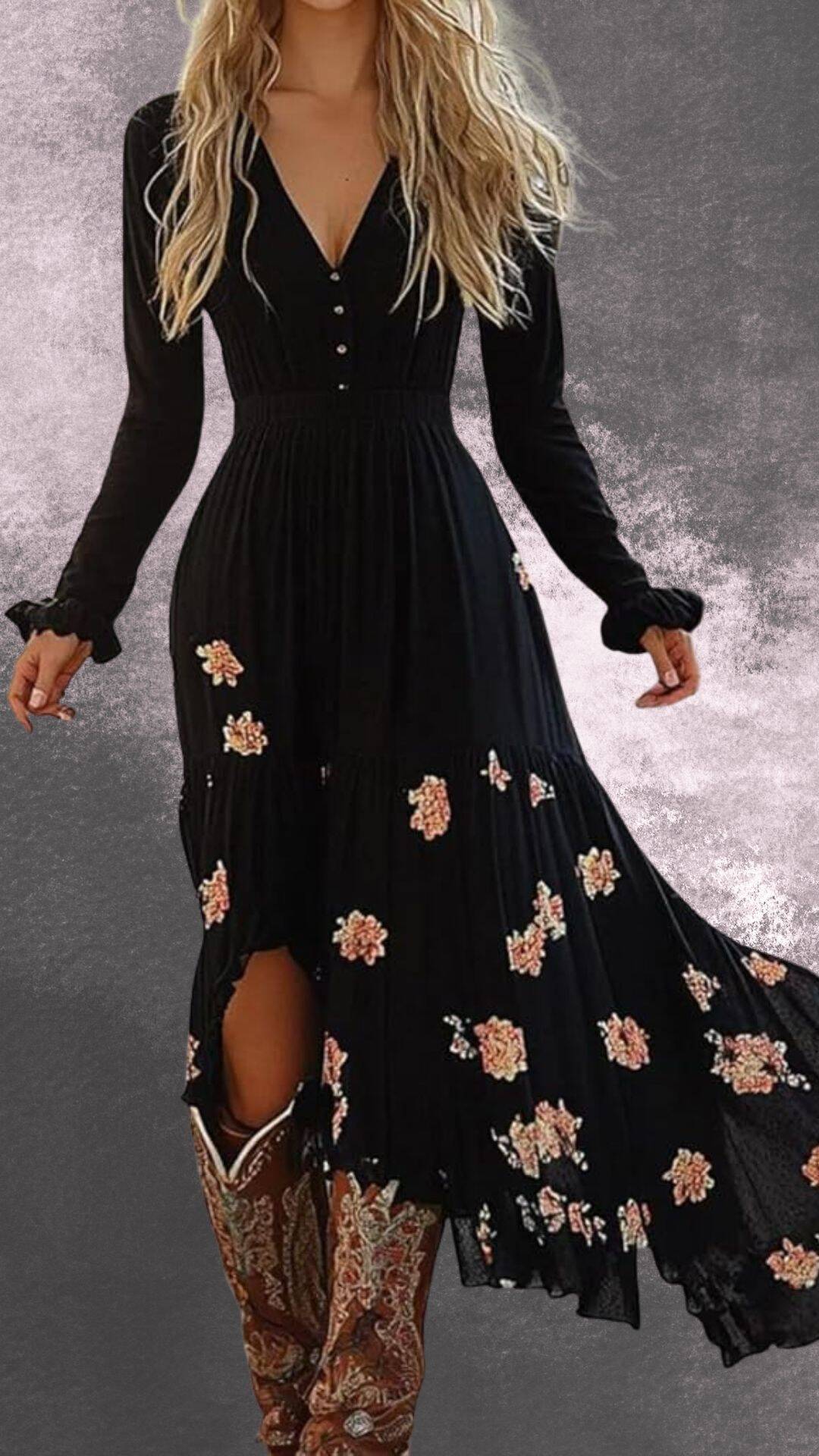 This elegant black maxi dress features a flattering V-neckline, long sleeves, and delicate floral embroidery in soft pinks and yellows. The dress has a fitted bodice that flows into a tiered, slightly flared skirt with a high slit, making it a stylish complement to cowboy boots for a country western vibe. The fabric has a gentle drape, enhancing both comfort and movement.