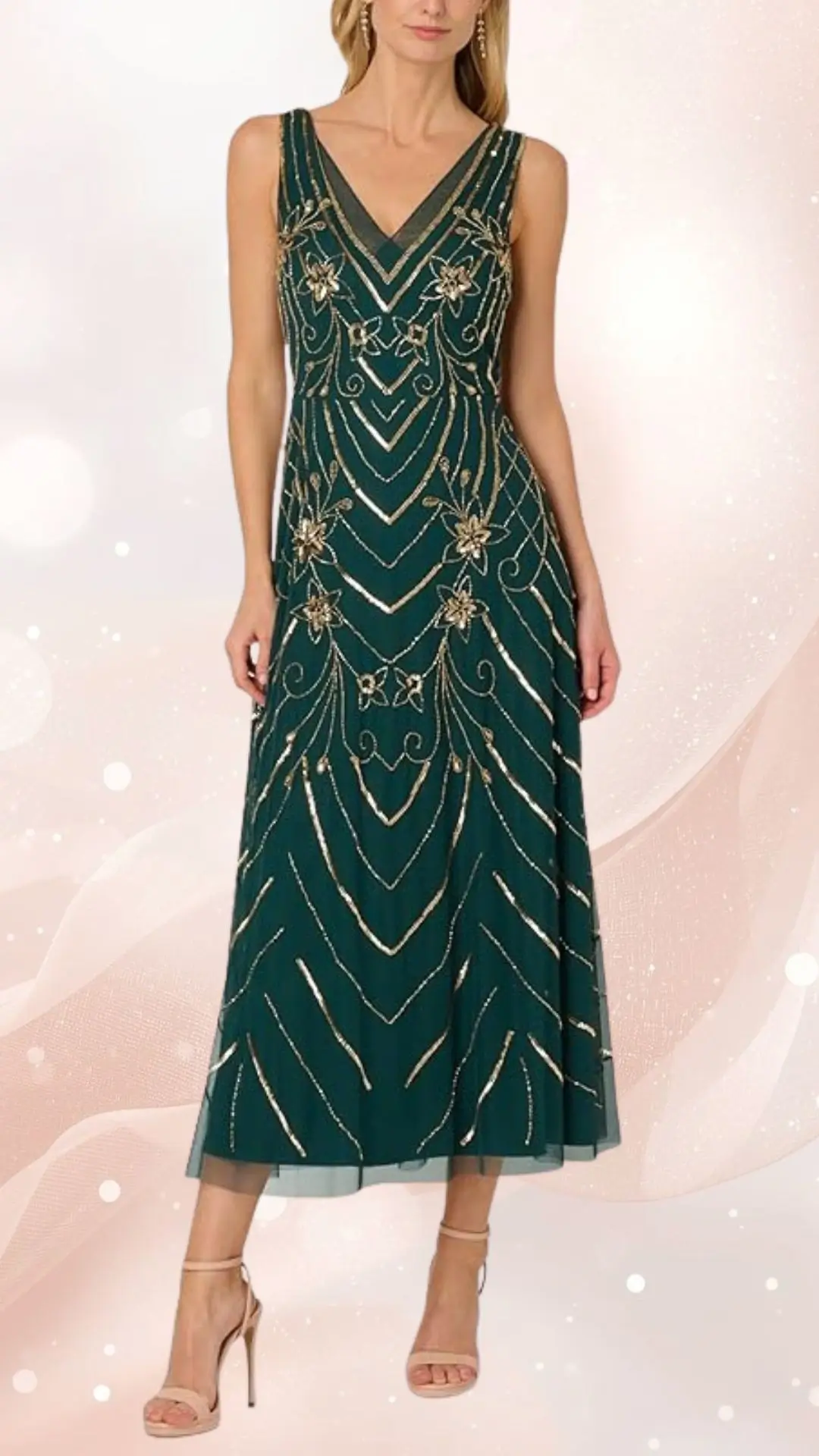 The image features a sleeveless, floor-length spring mesh wedding guest dress in a rich dark green hue, adorned with intricate golden embroidery forming a chevron pattern throughout. The dress has a flattering V-neckline and is complemented by nude strappy high-heeled sandals, enhancing its elegant look. The fabric creates a soft, flowing silhouette, perfect for formal occasions.