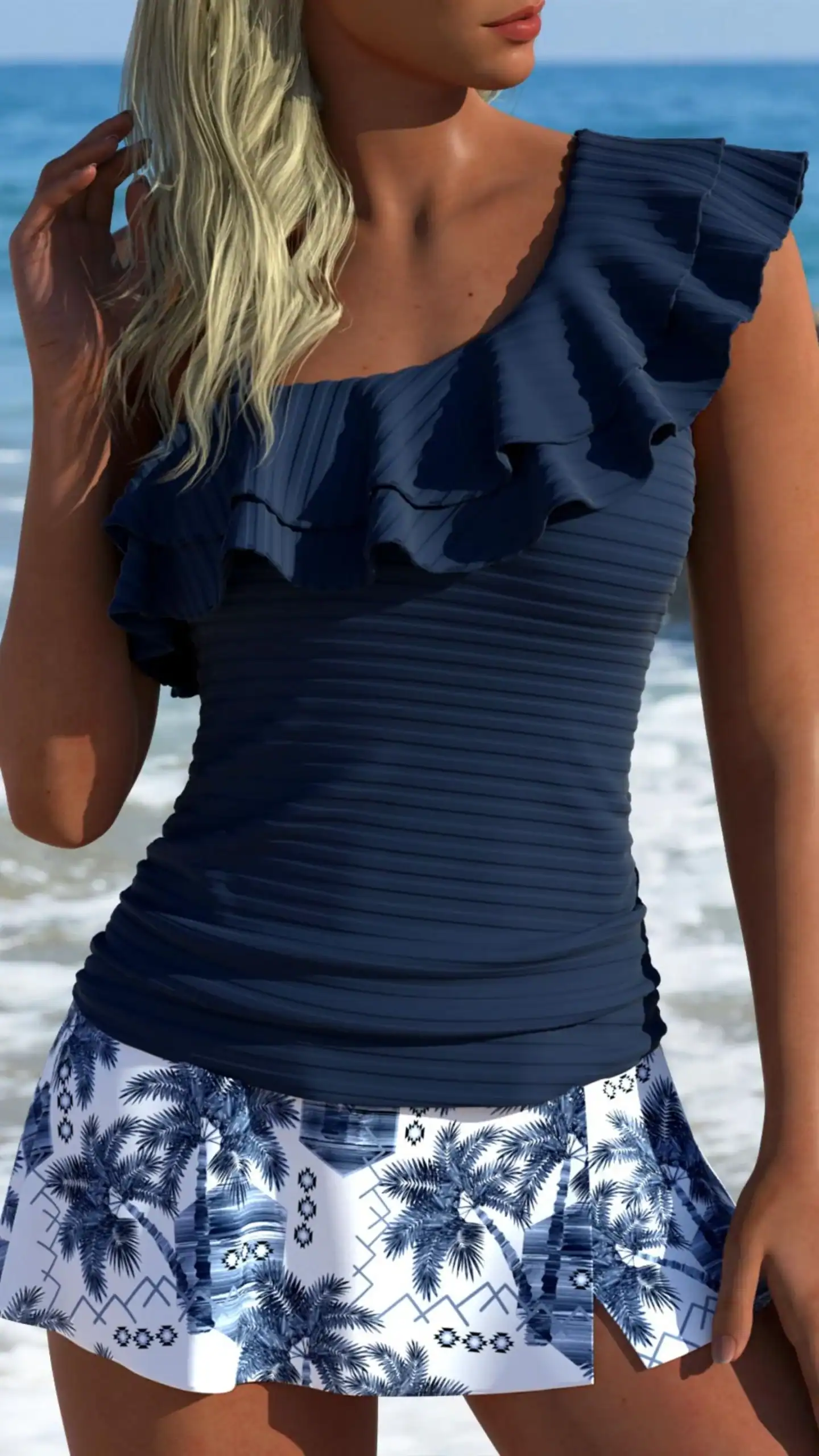 This tankini features a one-shoulder silhouette with a playful ruffled neckline, crafted from a soft, stretchy fabric that offers a comfortable fit. The design showcases a deep navy top paired with a white skirt adorned with blue palm tree graphics and geometric patterns, creating a vibrant, tropical vibe that's perfect for beach outings or pool parties.