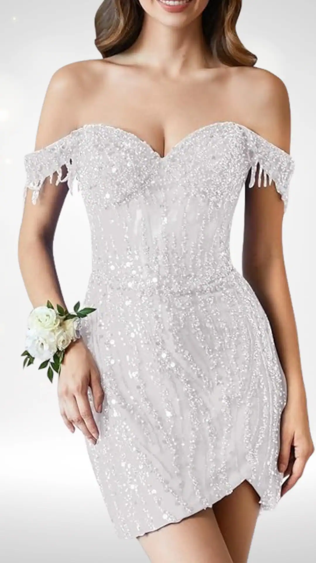 This off-the-shoulder homecoming dress features a fitted silhouette crafted from shimmering sequined fabric in a soft white hue, adorned with delicate fringe detailing on the sleeves. The overall vibe is both glamorous and trendy, making it ideal for a formal occasion like homecoming or prom, designed specifically for teenage girls.