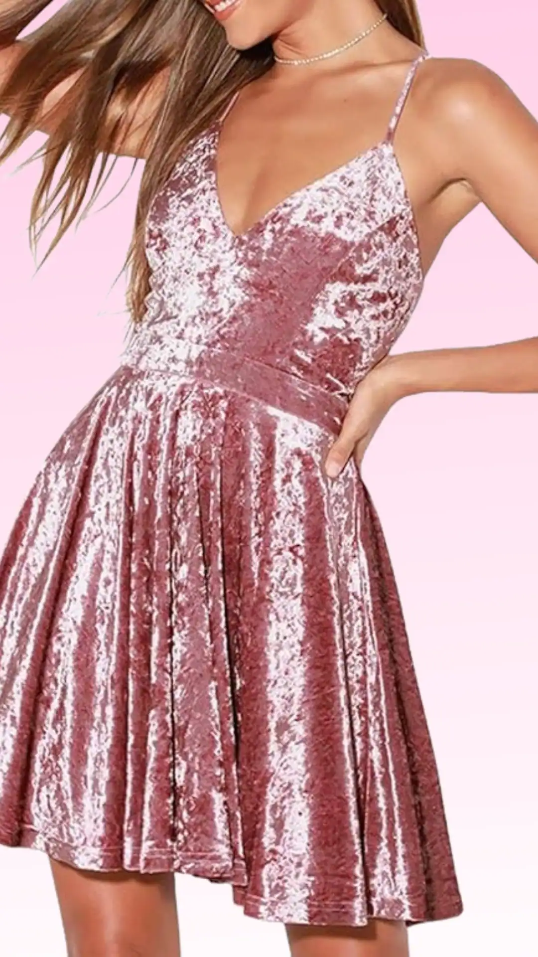 This pink homecoming dress features a shimmering, textured velvet fabric, creating a playful yet sophisticated vibe. It has a fitted bodice with a plunging neckline and a flared skirt, making it perfect for a formal event like homecoming, targeting teenage girls seeking a trendy and cute style.