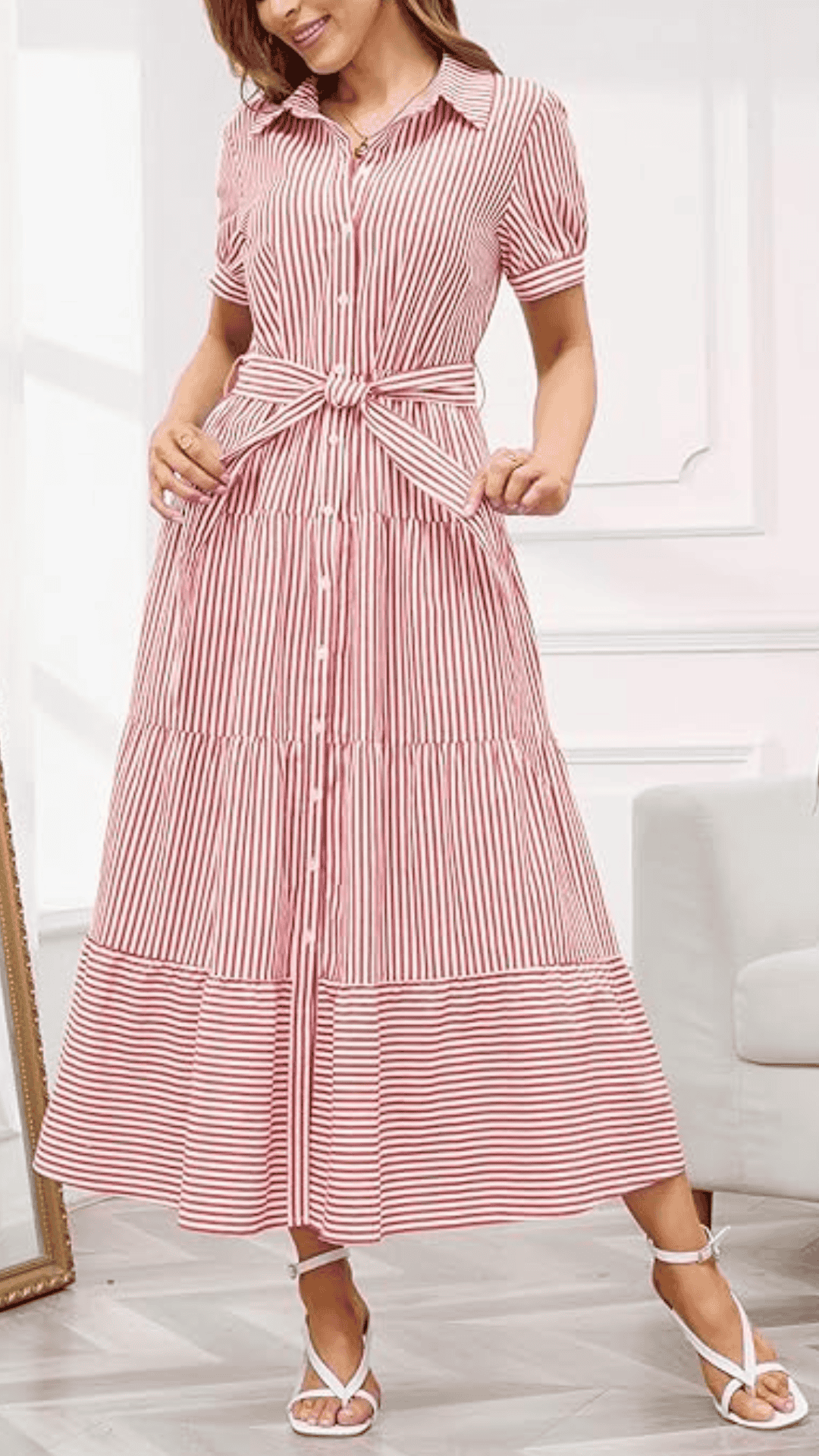 The outfit features a classy, knee-length dress in a vibrant red and white striped pattern, crafted from lightweight cotton for a comfortable feel; it showcases a collared neckline, short sleeves, and a tied waist detail, creating a flattering silhouette. Ideal for casual July 4th gatherings, this design exudes a cheerful and festive vibe while remaining effortlessly stylish.
