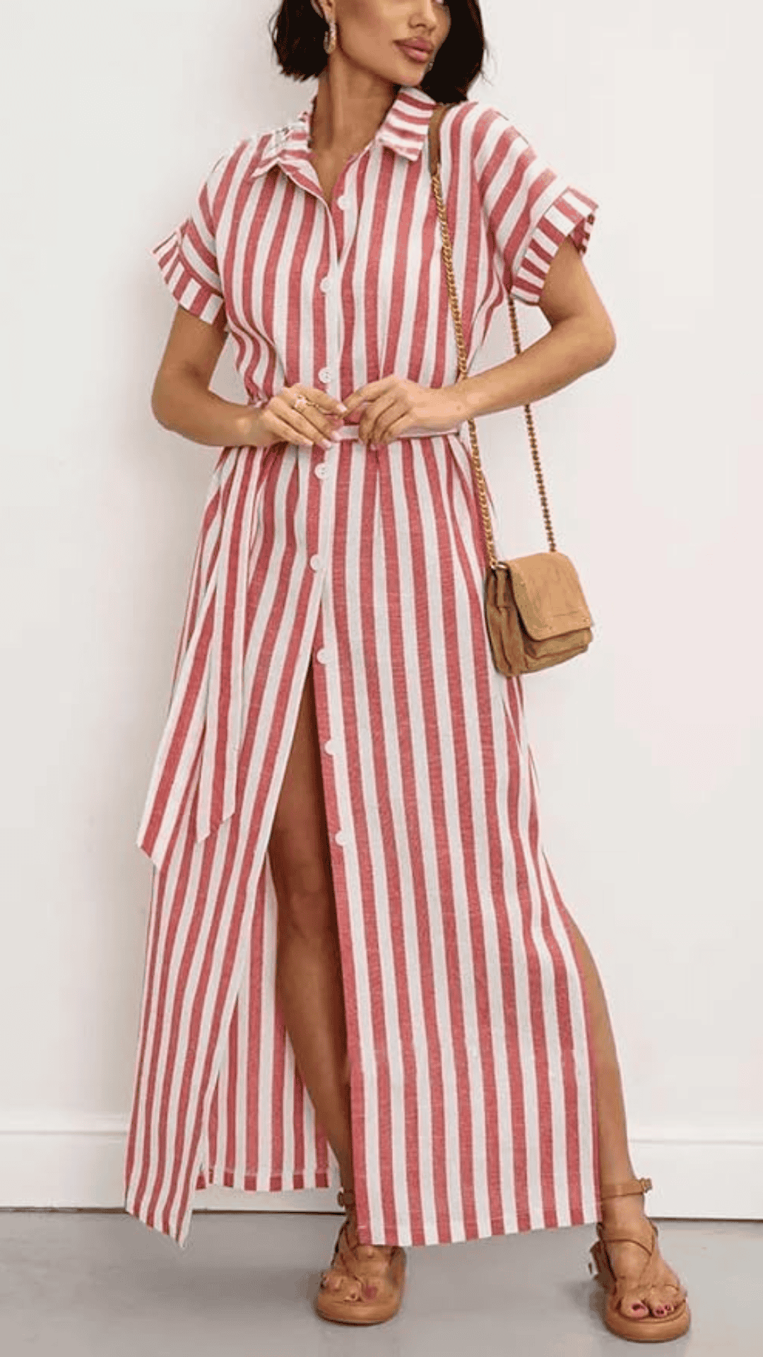 This red and white striped maxi dress features a lightweight, breathable fabric with a soft texture, designed with a classic collared neckline and short rolled sleeves. The playful yet elegant style is perfect for casual 4th of July celebrations, offering both comfort and a vibrant festive look.