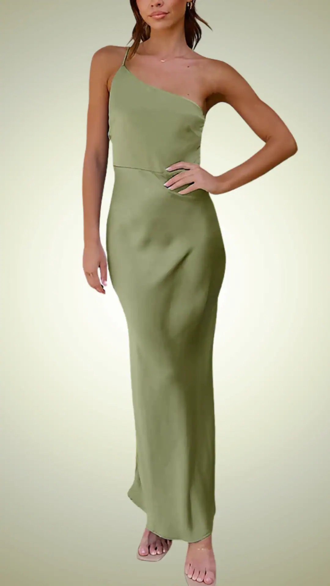 Sage green dress with a fitted silhouette and single shoulder strap, perfect for formal fall weddings. Minimalist design ideal for chic and understated looks.