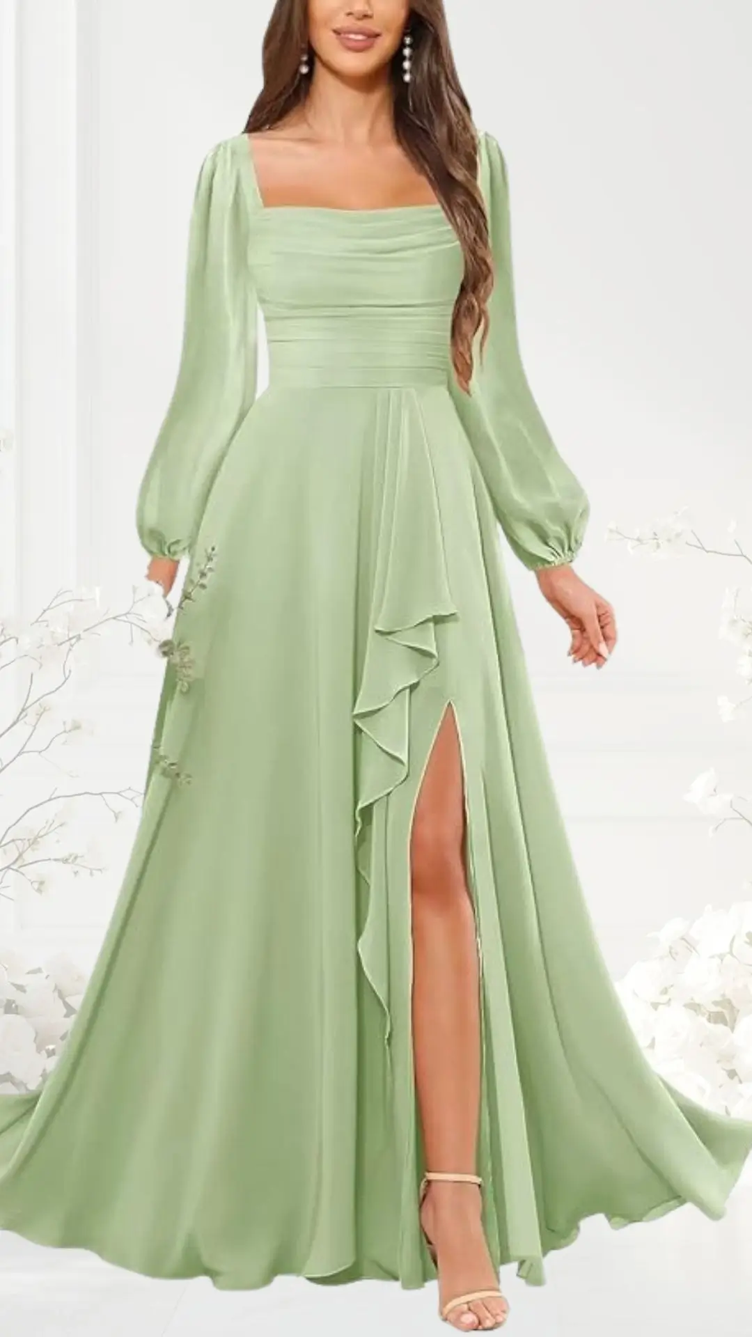 The sage green wedding guest dress features a square neckline and long, puffed sleeves, flowing elegantly to the floor. It has a subtle ruffled detail on one side, paired with a thigh-high slit for added sophistication. The lightweight fabric captures movement beautifully, making it suitable for formal occasions.