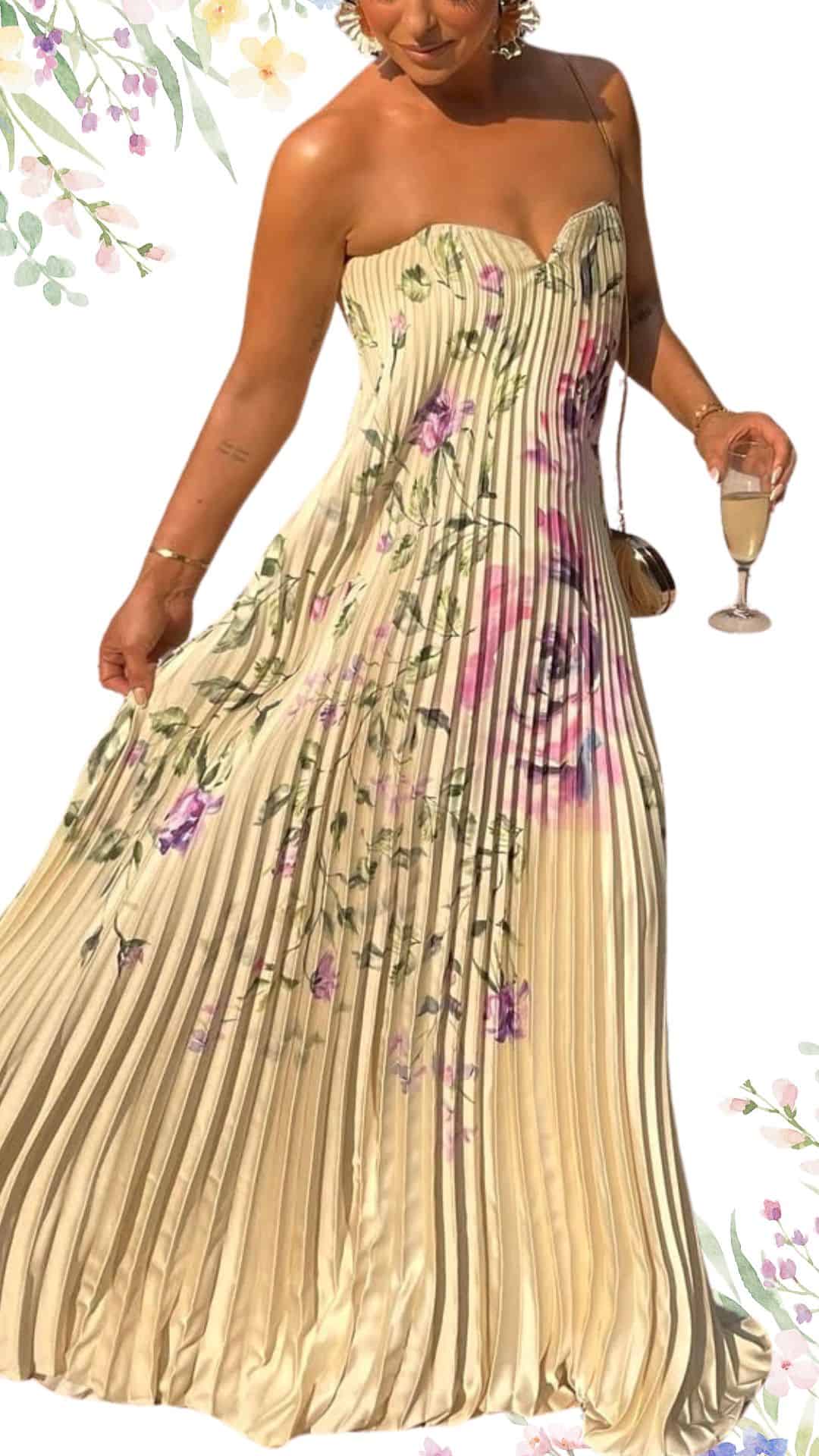 A strapless, pleated gown in a soft ivory shade features delicate floral patterns in shades of pink and green. The floor-length design showcases a gracefully flowing silhouette, with a subtle sweetheart neckline and a flattering fitted bodice. This elegant dress exudes class, making it an ideal choice for a spring wedding.