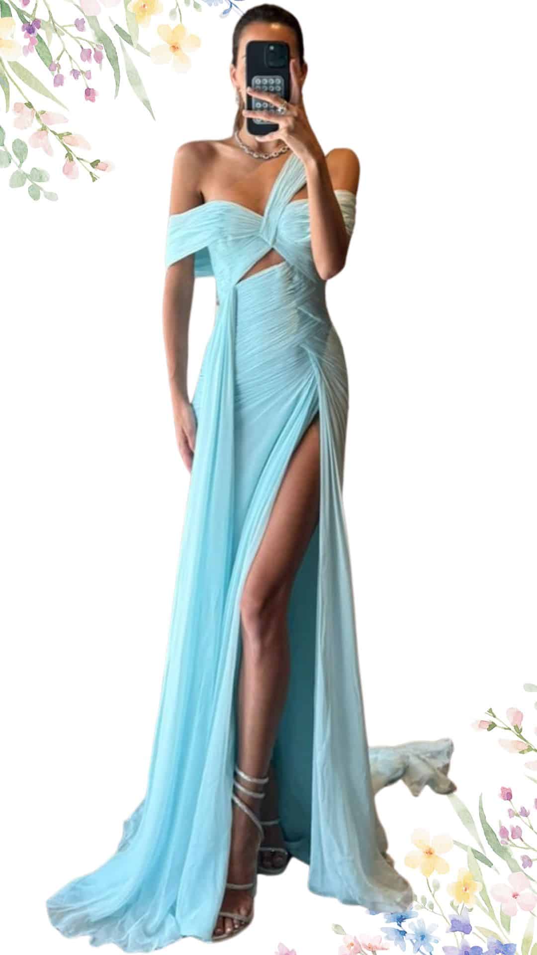 This elegant spring wedding guest dress features a soft, sky-blue color with a figure-hugging silhouette. It has an off-the-shoulder neckline, and the flowing fabric creates a sophisticated drape, accentuated by an alluring thigh-high slit. The dress is designed for a dramatic effect, combining sleek textures with a floor-length hemline.