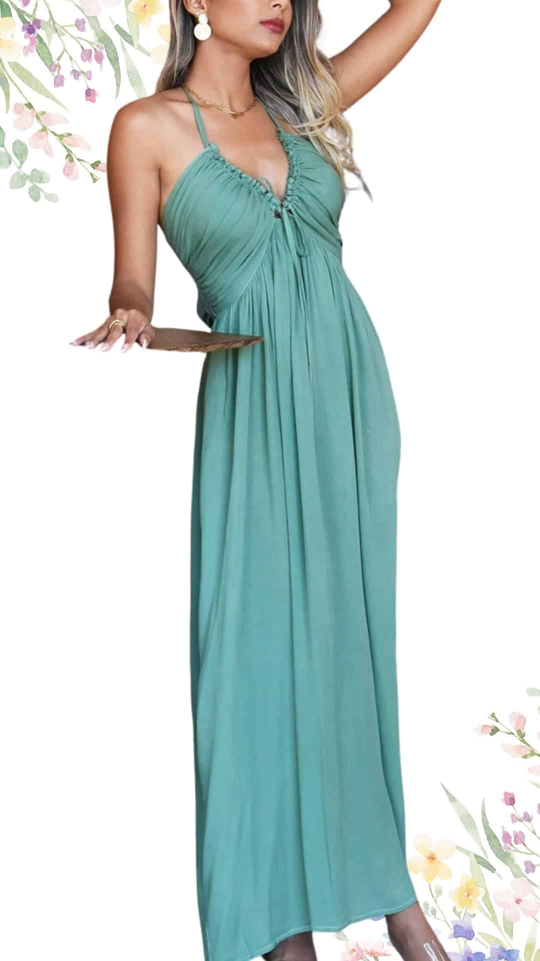 The dress features a flowing, floor-length design in a soft, muted teal shade. It has a deep V-neckline with delicate ruching and adjustable spaghetti straps that add elegance, while the lightweight fabric drapes gracefully, creating a beautiful silhouette perfect for a spring wedding. The hemline is slightly uneven, enhancing the dress's romantic and sophisticated look.